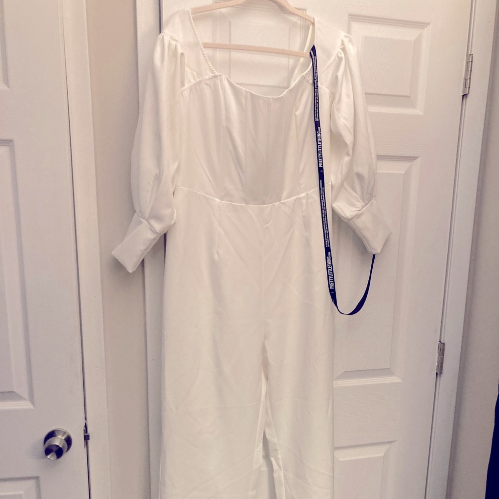 White brand new off the shoulder bubble sleeve jumpsuit.
